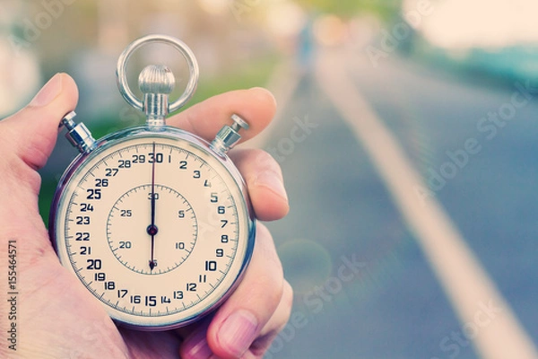 Obraz Old vintage chronometer in young man hand ready to start