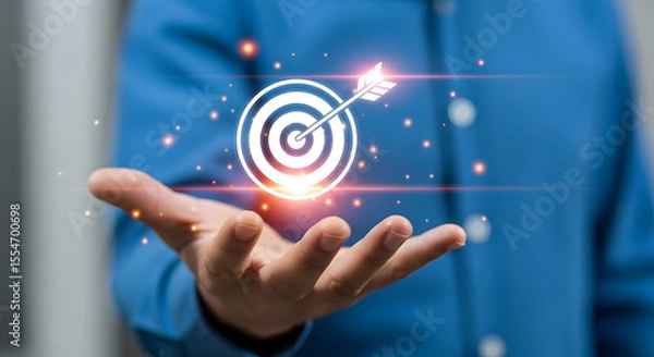 Fototapeta Businessman holding holographic target with arrow, symbolizing goal setting and achieving success in professional environment.