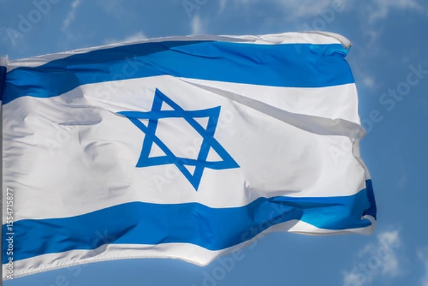 Fototapeta Large Israel flag waving in the wind. Israeli flag for advertising, holidays, achievements, festivals, elections. The Israeli flag flutters in the beautiful sky. Great for news.