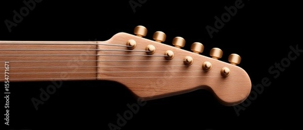 Obraz Close-up of a wooden guitar headstock with golden tuning pegs