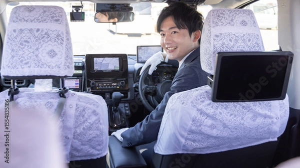 Fototapeta タクシードライバーに行き先を伝える客
