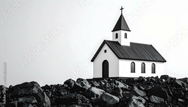 Obraz Black and white image of a small church situated on a rocky outcrop against a bright sky