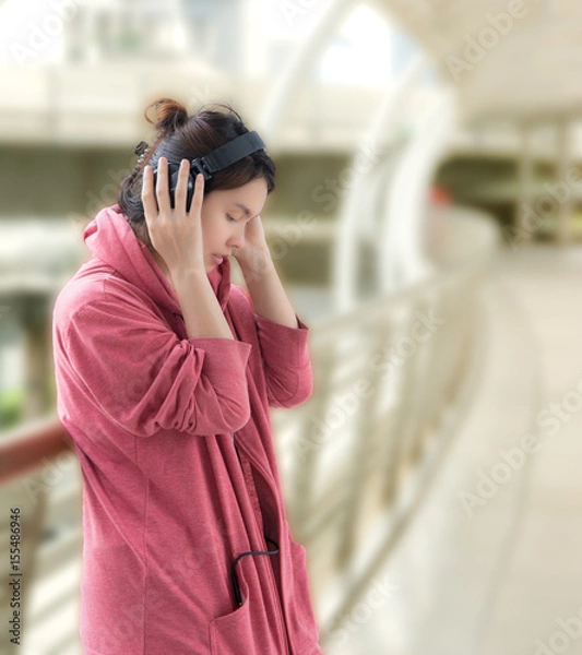 Fototapeta Cute, pretty and beautiful girl with soft texture enjoy music with her headphone