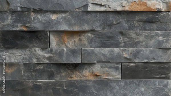 Fototapeta Close-up of a textured gray stone wall with rough layered surface and natural color variations for architectural and design themes