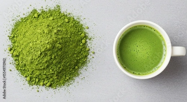 Obraz Creative top-down matcha layout powdered green tea on the left, fresh whisked matcha on the right in white cup, highlighting texture contrast, clean aesthetic.