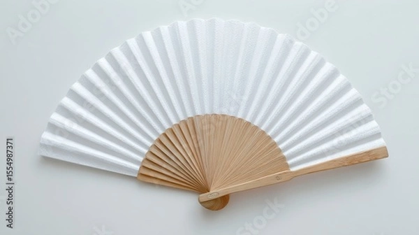 Fototapeta Stunning photo of mockup of a white folding hand fan set apart against a white background.