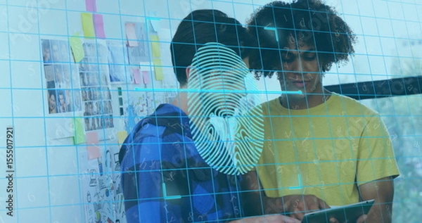 Fototapeta Collaborating duo examining tablet in office, with sticky notes wall and fingerprint graphic