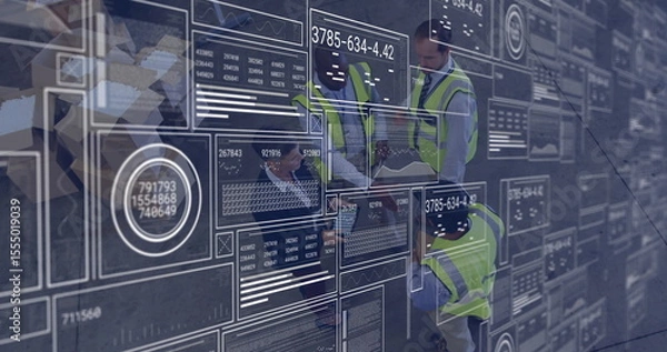 Obraz Analyzing digital data interfaces and graphs, engineers in safety vests working