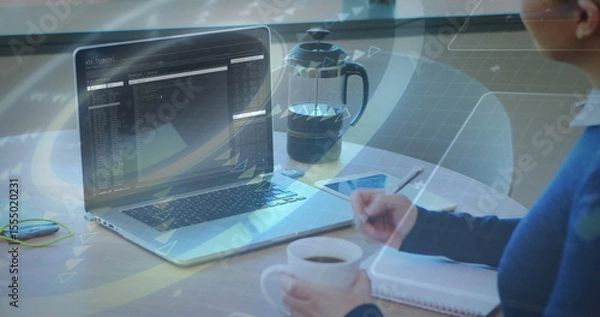 Obraz Person working on laptop with data processing image over coffee and notepad