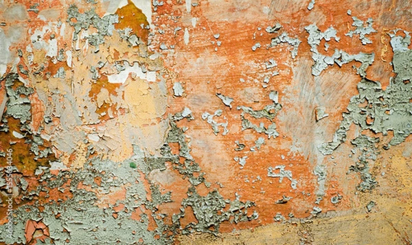 Obraz Old surface with peeling paint and rust. Vintage background with crackles and peeling paint of yellow, brown, gray, orange and blue colors.