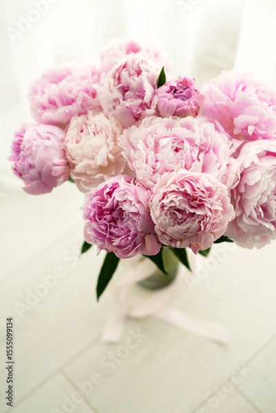 Obraz Bouquet of Fresh Pink Peonies with Green Leaves on a Light Background