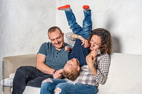 Fototapeta Happy family with pregnant woman expecting another baby.
Concept of maternity, parenting, preparation and expectation for baby.