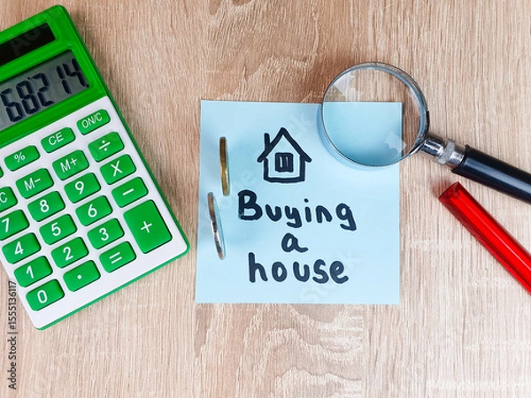 Obraz Buying a House text,writing a note on a piece of paper with a calculator drawing of a house,renting a house,real estate,buying,real estate services,affordable housing.