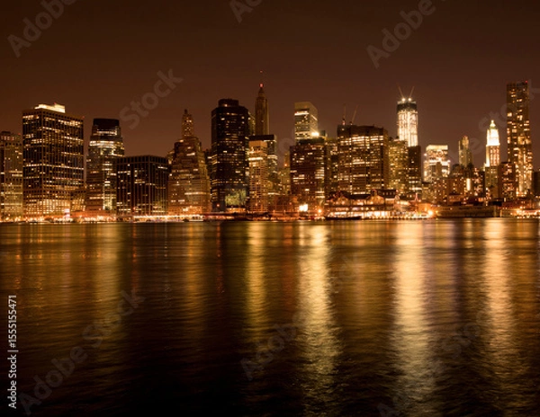 Fototapeta Lower Manhattan at night with a gold filter