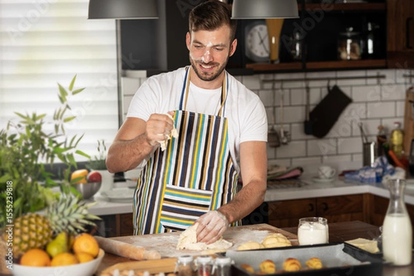 Obraz Happy baker kneading dough
