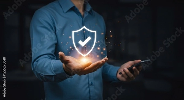 Fototapeta Man's Hand Holding Glowing Shield Symbolizing Data Protection and Security