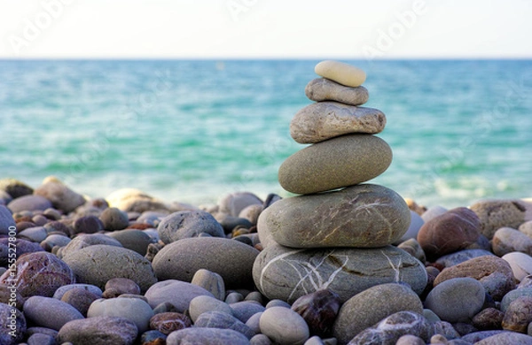 Obraz Stack of pebbles on beach against sea