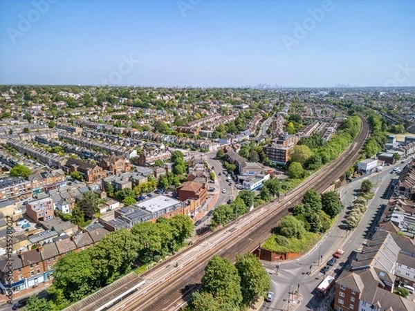 Fototapeta The drone aerial view of Raynes Park. Raynes Park is a residential suburb, railway station and local centre near Wimbledon, London, and is within the London Borough of Merton.