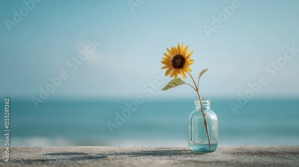 Obraz Minimalist Sunflower in Glass Vase by the Sea Under Soft Morning Light