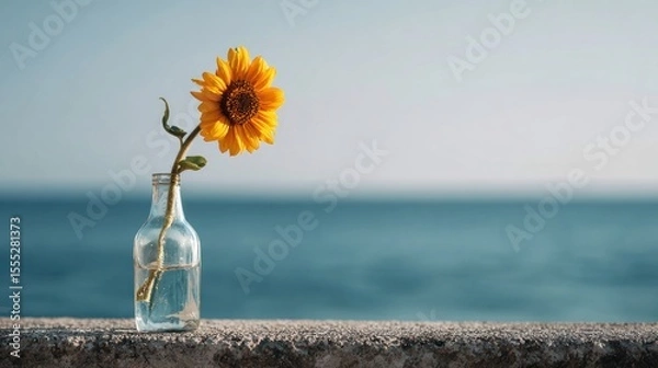 Obraz Minimalist Sunflower in Glass Vase by the Sea Under Soft Morning Light