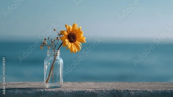 Obraz Minimalist Sunflower in Glass Vase by the Sea Under Soft Morning Light