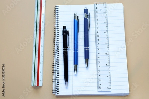 Fototapeta Pen and paper with ruler. Office supply concept. Ready to work.