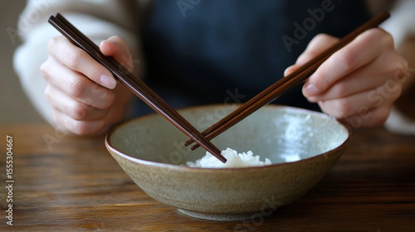 Fototapeta Etiquette differs: For example, never point with chopsticks or stick them upright in rice in East Asia. 