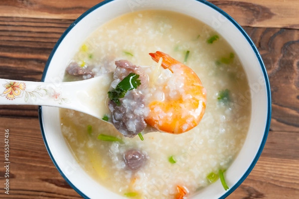 Obraz top view fresh shrimps and beef porridge at horizontal composition