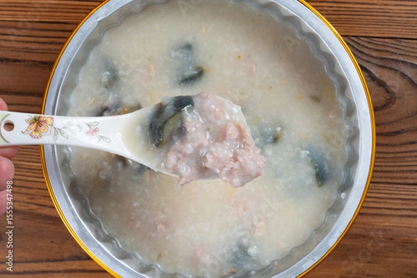 Obraz top view porridge with pork and preserved egg