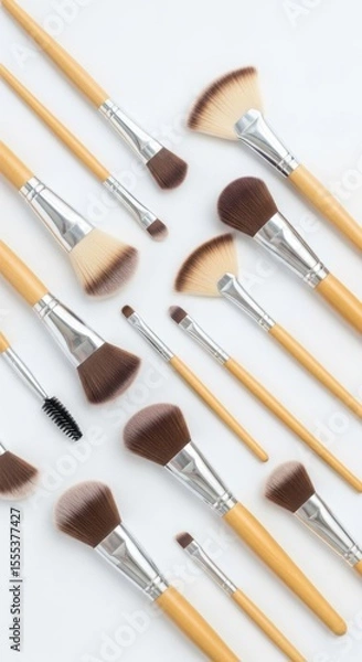 Obraz An arrangement of various cosmetic applicators on a clean, light background
