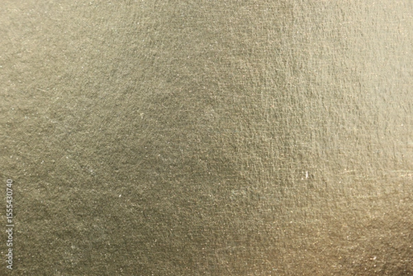 Fototapeta Gold-colored metallic surface close-up abstract textured background