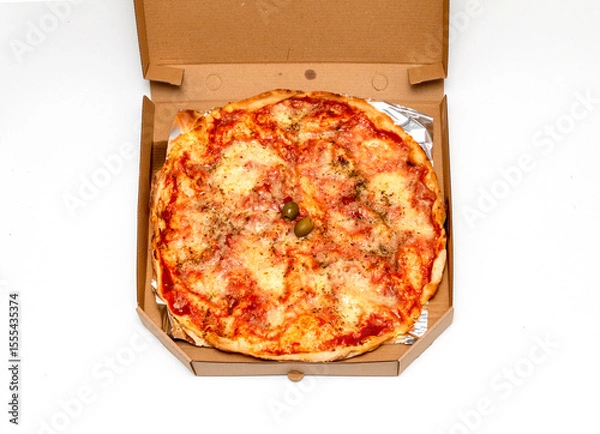 Obraz Baked pizza inside open cardboard delivery box
