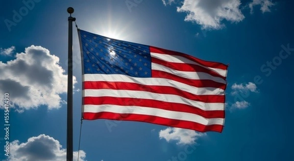 Obraz American flag billowing proudly in a bright, sunny sky.