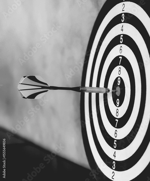 Fototapeta Darts arrows hitting the center of dartboard, business success concept