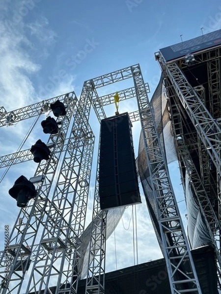 Fototapeta Installation of professional sound speakers, line array and stage equipment for a concert.