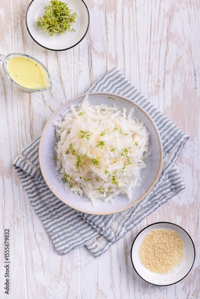 Obraz Daikon radish salad with cress and mustard and honey dressing