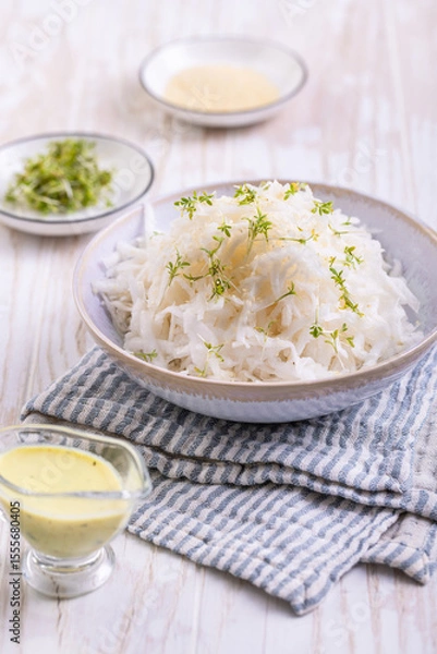 Obraz Daikon radish salad with cress and mustard and honey dressing