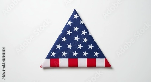 Obraz A neatly folded American flag displayed on a seamless white background.
