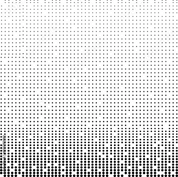 Fototapeta Halftone. Black dots on a white background. A pattern of round black dots of different sizes. Many dots of different sizes, creating gradations of brightness or shadow.