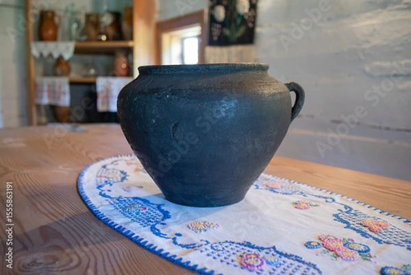Obraz Vases standing on a table.