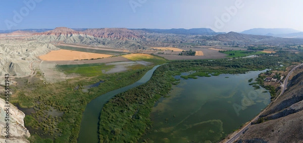 Fototapeta Nallihan Bird Sanctuary Ankara Turkey Panoramic view of a river winding through a colorful landscape. High-angle, panoramic shot of a river snaking through a valley with diverse terrain. Turkiye