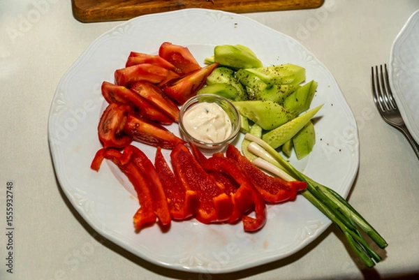 Obraz A plate of tomato pepper and cucumber salad