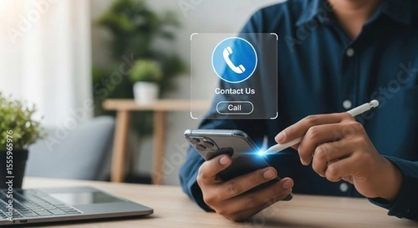 Fototapeta Connecting with ease: A man uses his smartphone to call through a holographic button, combining high-tech visuals with a personal touch