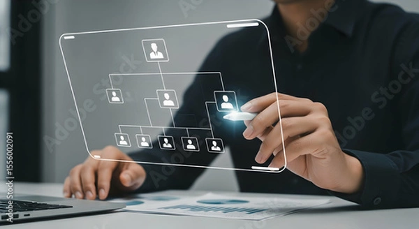 Fototapeta Person interacting with a digital organizational chart on a transparent screen