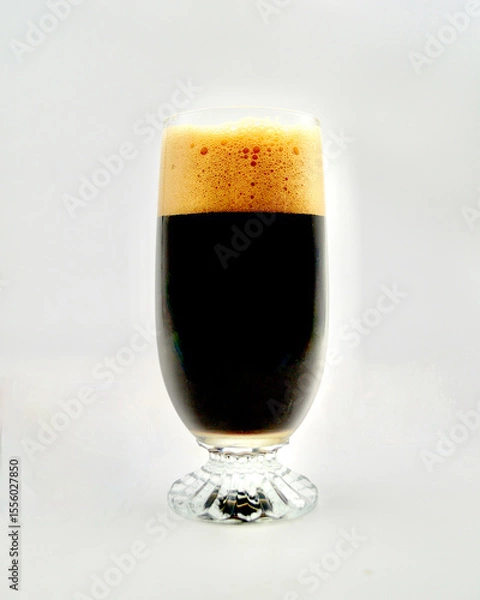 Obraz An oatmeal stout in a glass isolated against a white background.