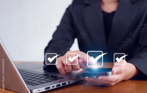 Fototapeta Businesswoman mark checkboxes, Survey form, check marks on checklist,Checklist concept.