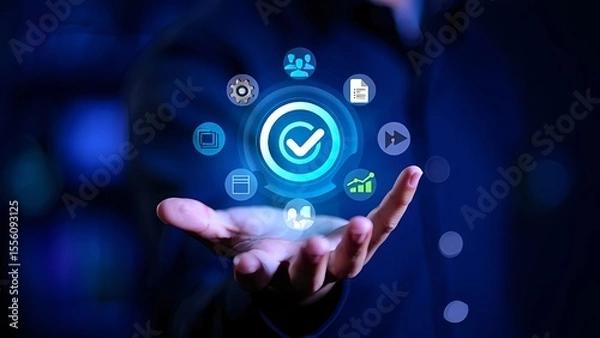 Fototapeta Conceptual showcase of a checkmark icon surrounded by workflow icons, presented within a person's hand, set against a blue backdrop.