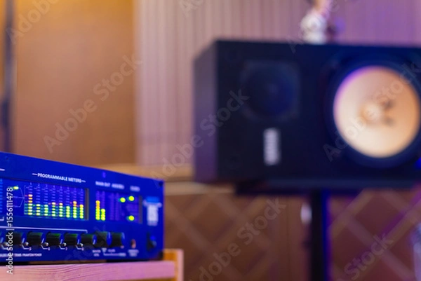 Obraz LED VU meter, audio meterbridge on loudspeaker monitor background in recording studio. music production, recording concept