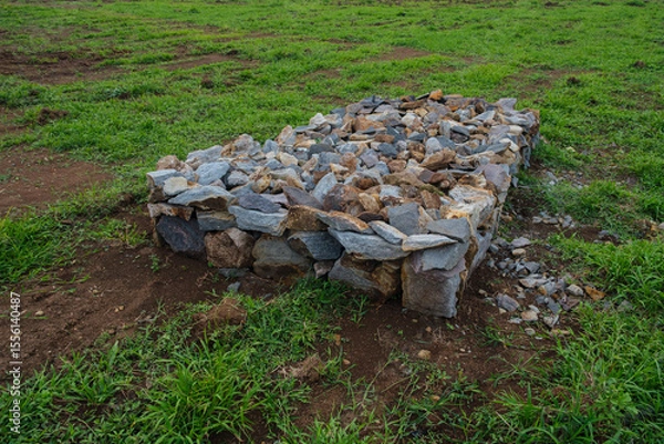 Obraz Stone Structure on Green Grass in an Open Outdoor Field