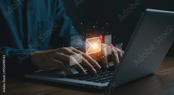 Obraz Person typing on a laptop with glowing email and document notifications appearing